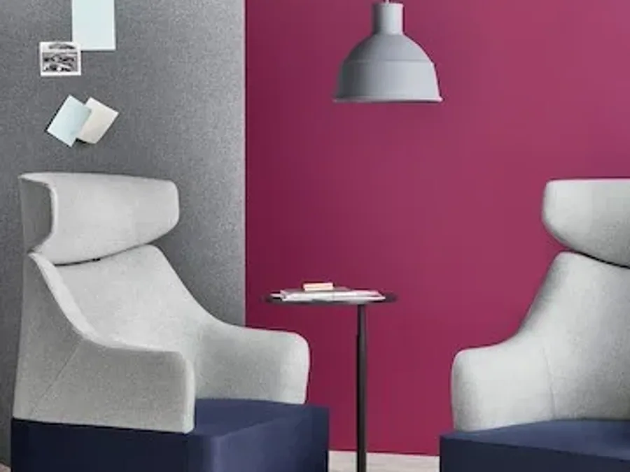 Hotel guestroom lounge chair coordinated with bed and room furniture