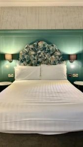 Upholstered bed manufacturers floral headboard hotel reference