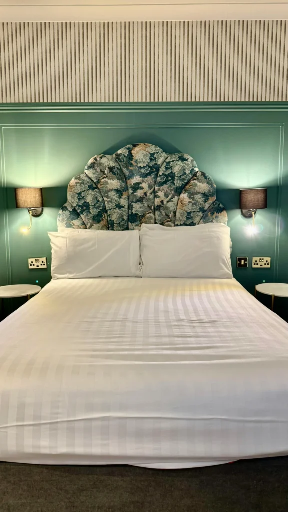 Upholstered bed manufacturers floral headboard hotel reference