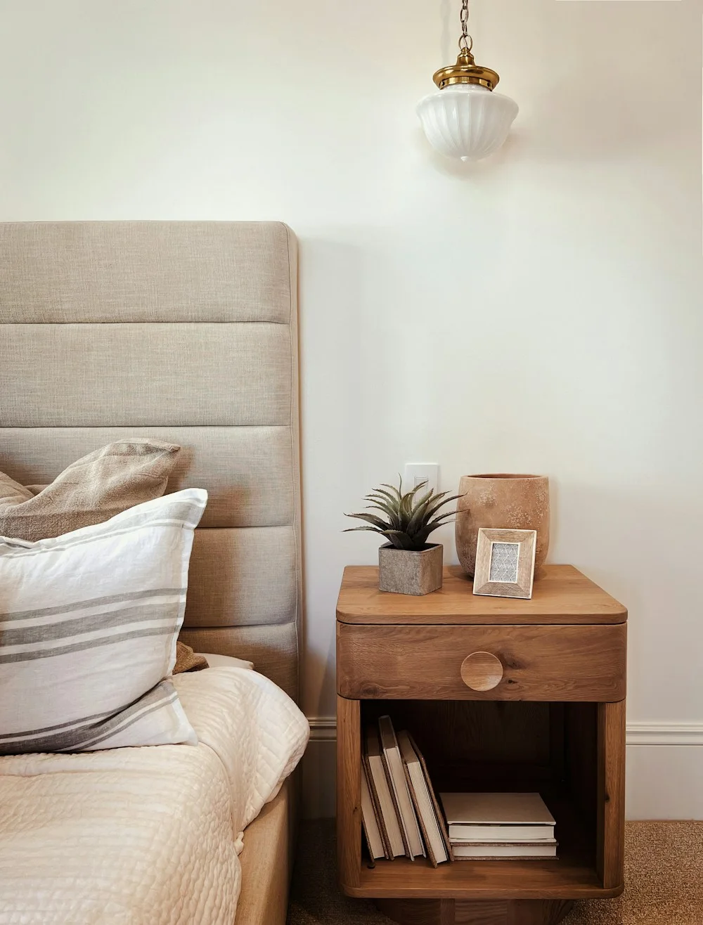 Upholstered headboard and bedside detail for custom bed orders