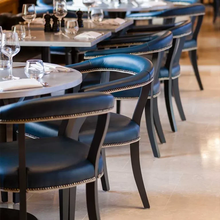 Commercial upholstered dining chairs in a hotel dining scene