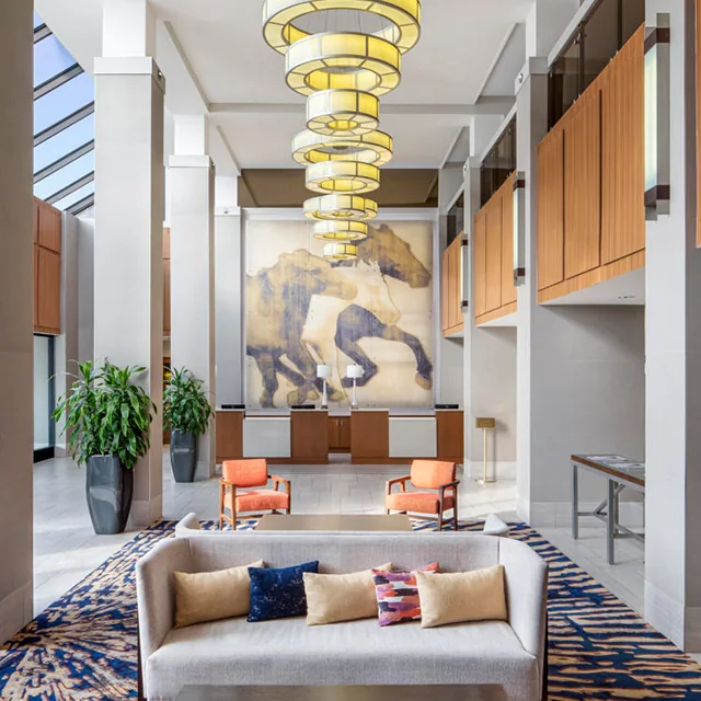 Hotel lobby sofa lounge scene with upholstered seating
