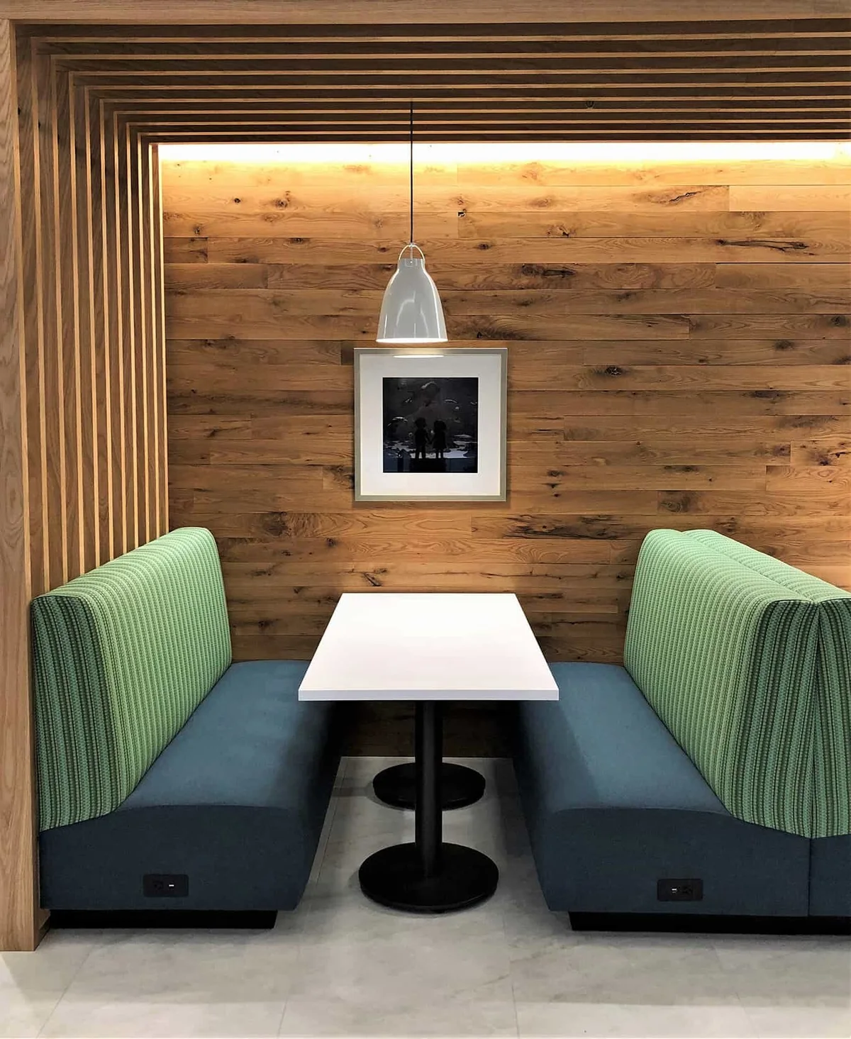 Restaurant banquette seating wall layout with tables and upholstered benches