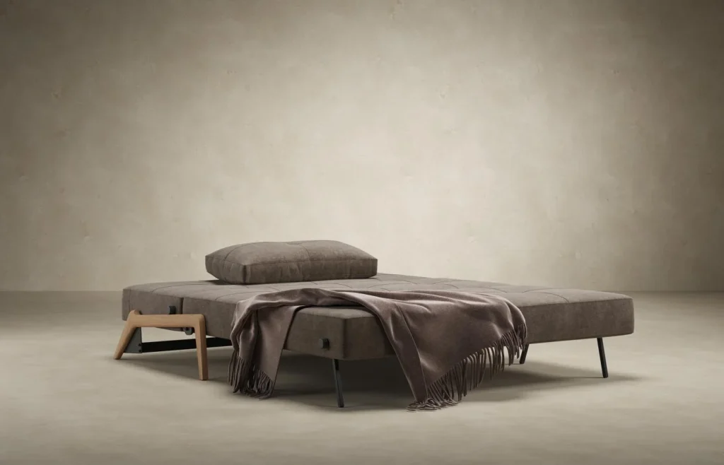 Sleeper sofa opened into bed position with front clearance