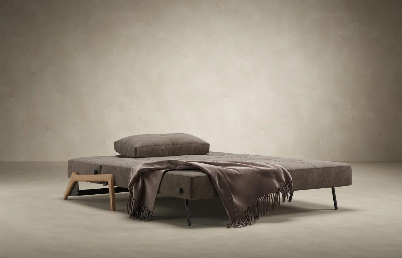 Sleeper sofa opened into bed position with front clearance