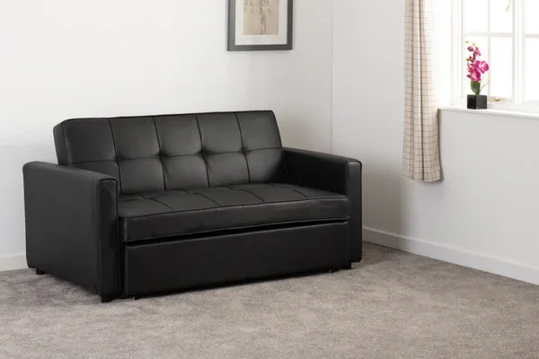 Black leather sofa bed opened as sleeper Black leather sofa bed opened as sleeper