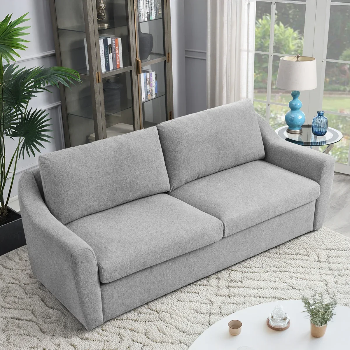 Closed pull-out sleeper sofa in an apartment room scene