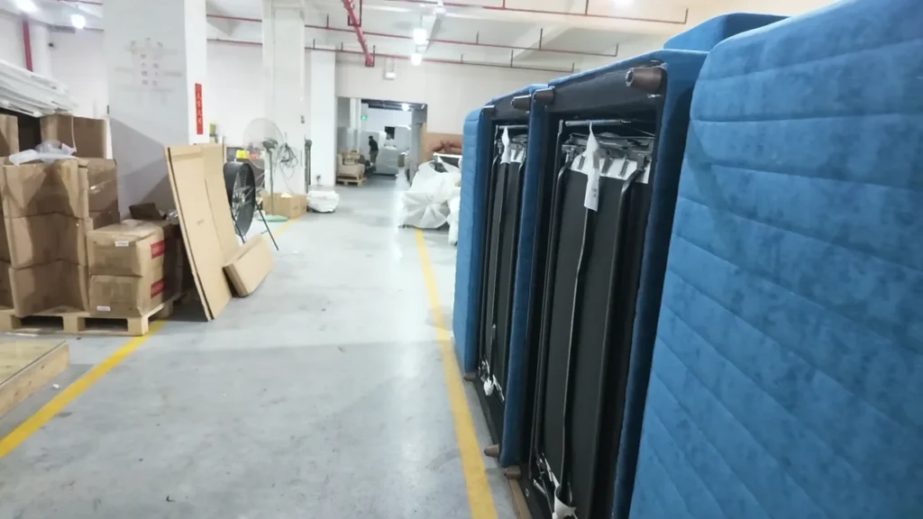 Poster frame showing sofa bed order staging inside the HUAXUAN factory.