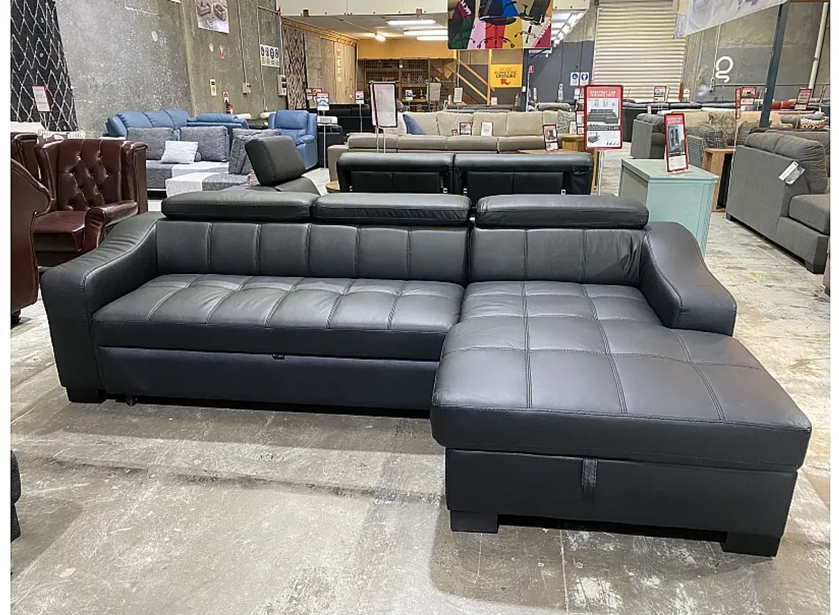 Leather sectional sofa bed chaise detail in showroom Leather sectional sofa bed chaise detail in showroom