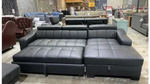 Black leather sofa bed in commercial showroom scene