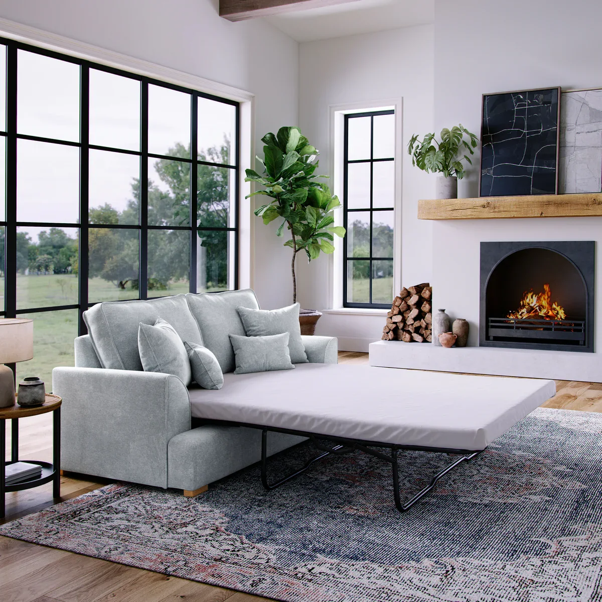 Pull-out sleeper sofa opened with metal frame visible in a living room