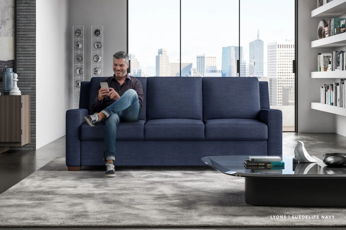 Pull-out sleeper sofa upholstery and seat form shown in a blue room scene