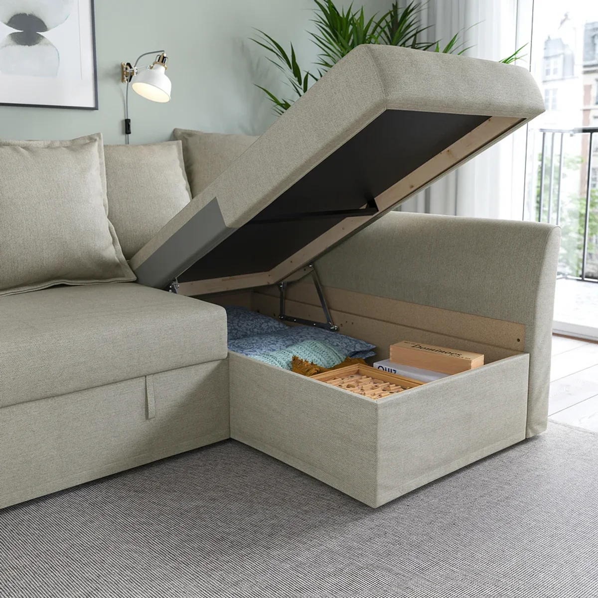 Sectional sofa bed chaise storage and pull-up detail Sectional sofa bed chaise storage and pull-up detail
