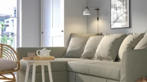 Sectional sofa with pull out bed in a compact room scene