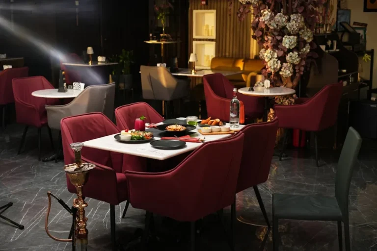 Compact upholstered club chairs arranged in a hotel lounge