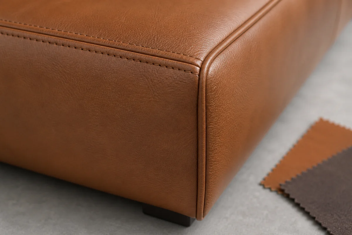Leatherette sofa seam piping and wrapped corner detail
