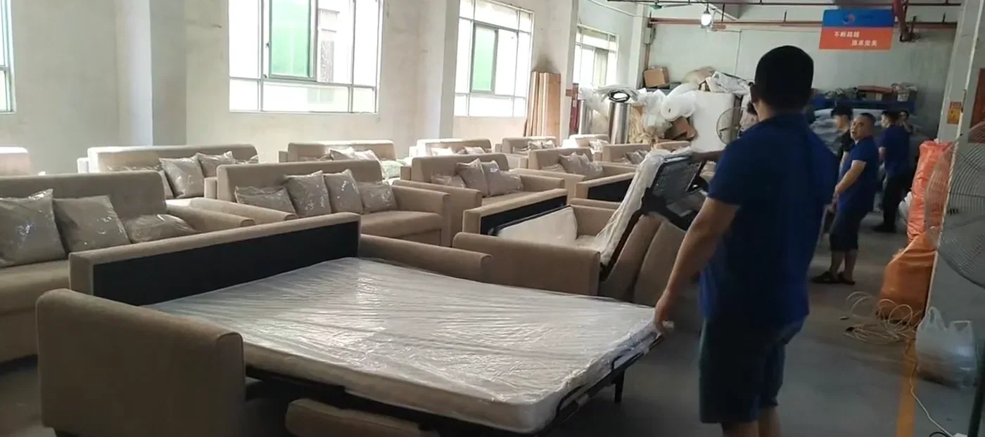 Pull-out sofa bed support and frame inspected in a furniture workshop