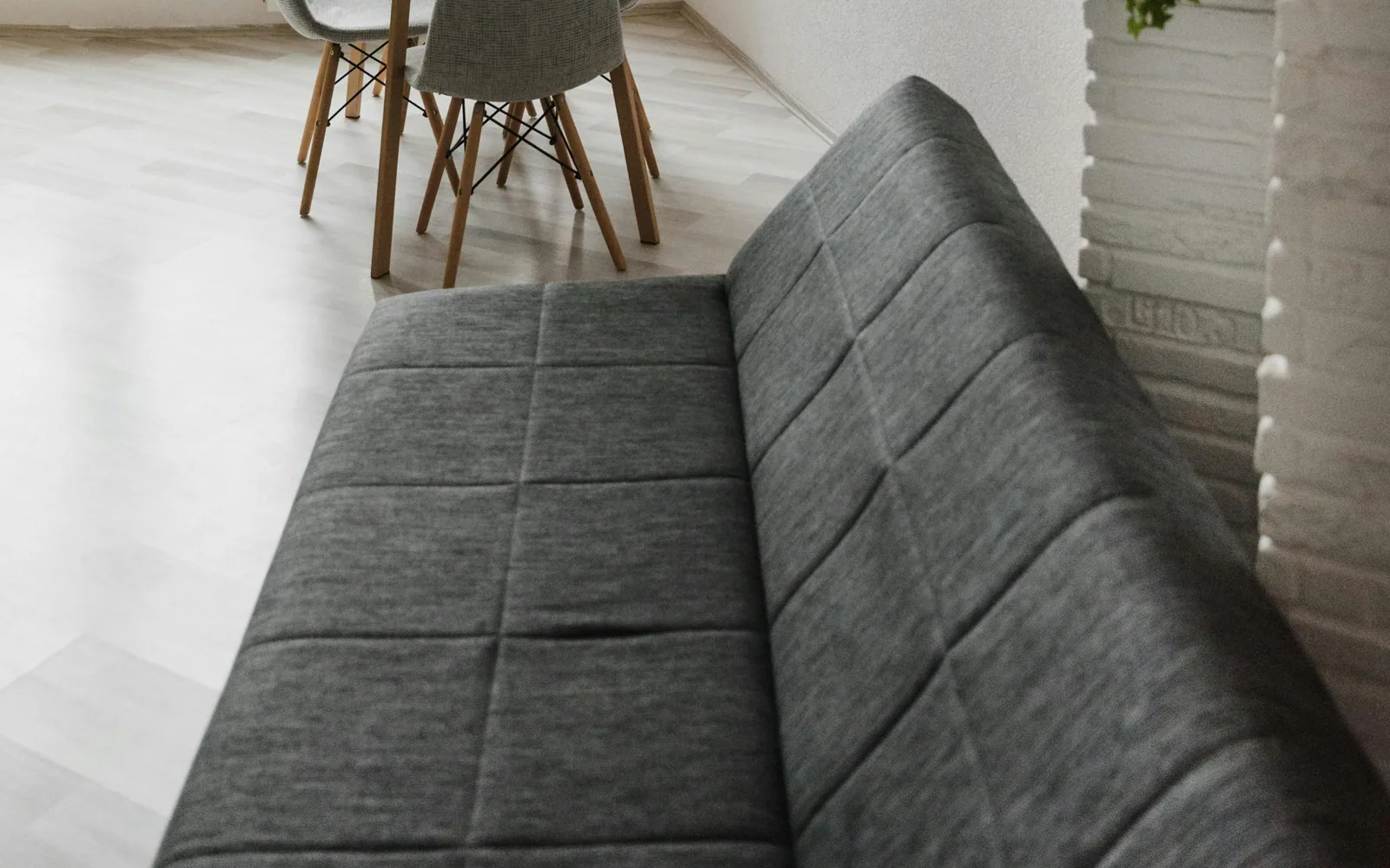 Compact sofa bed in its closed seating configuration
