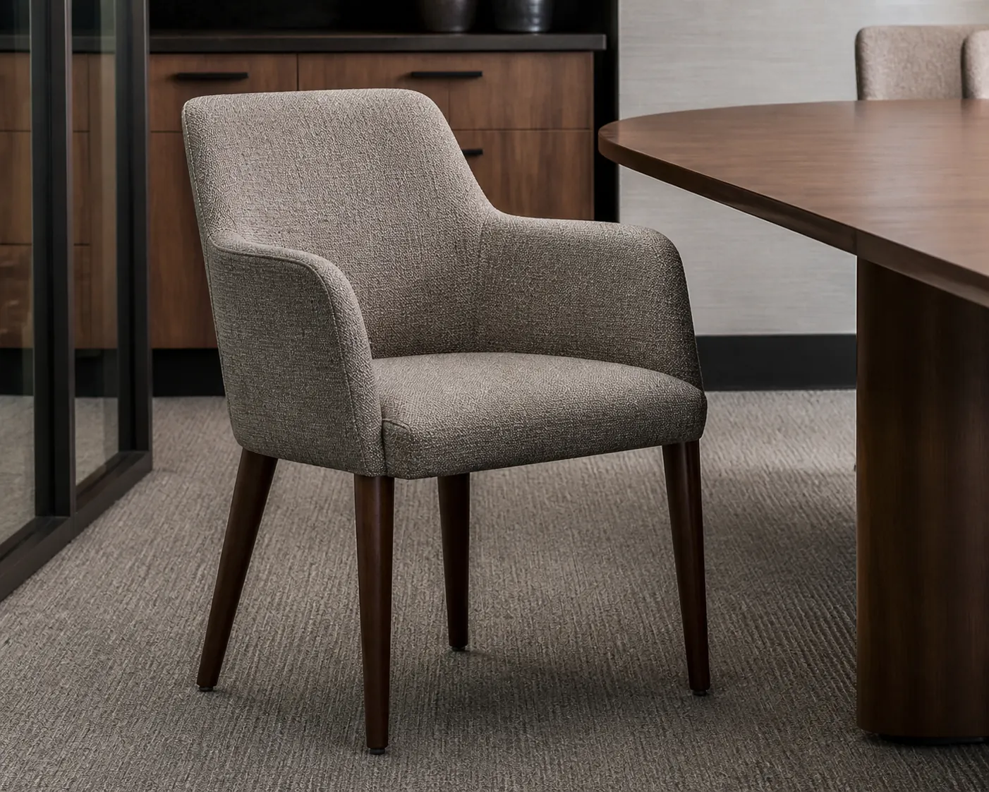 Upholstered conference armchair showing width armrests and floor footprint