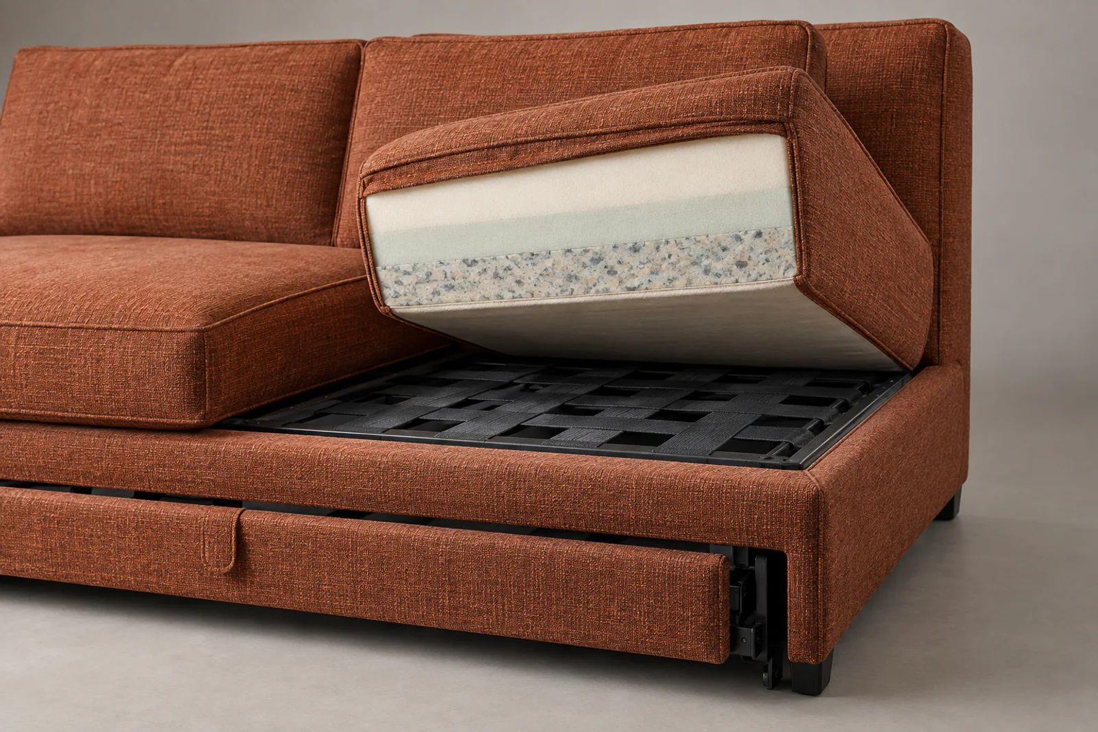 Armless sleeper sofa cushion showing layered foam and woven support