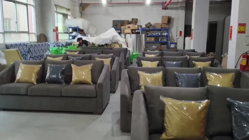 Rows of clean-lined modern sofas prepared in a workshop