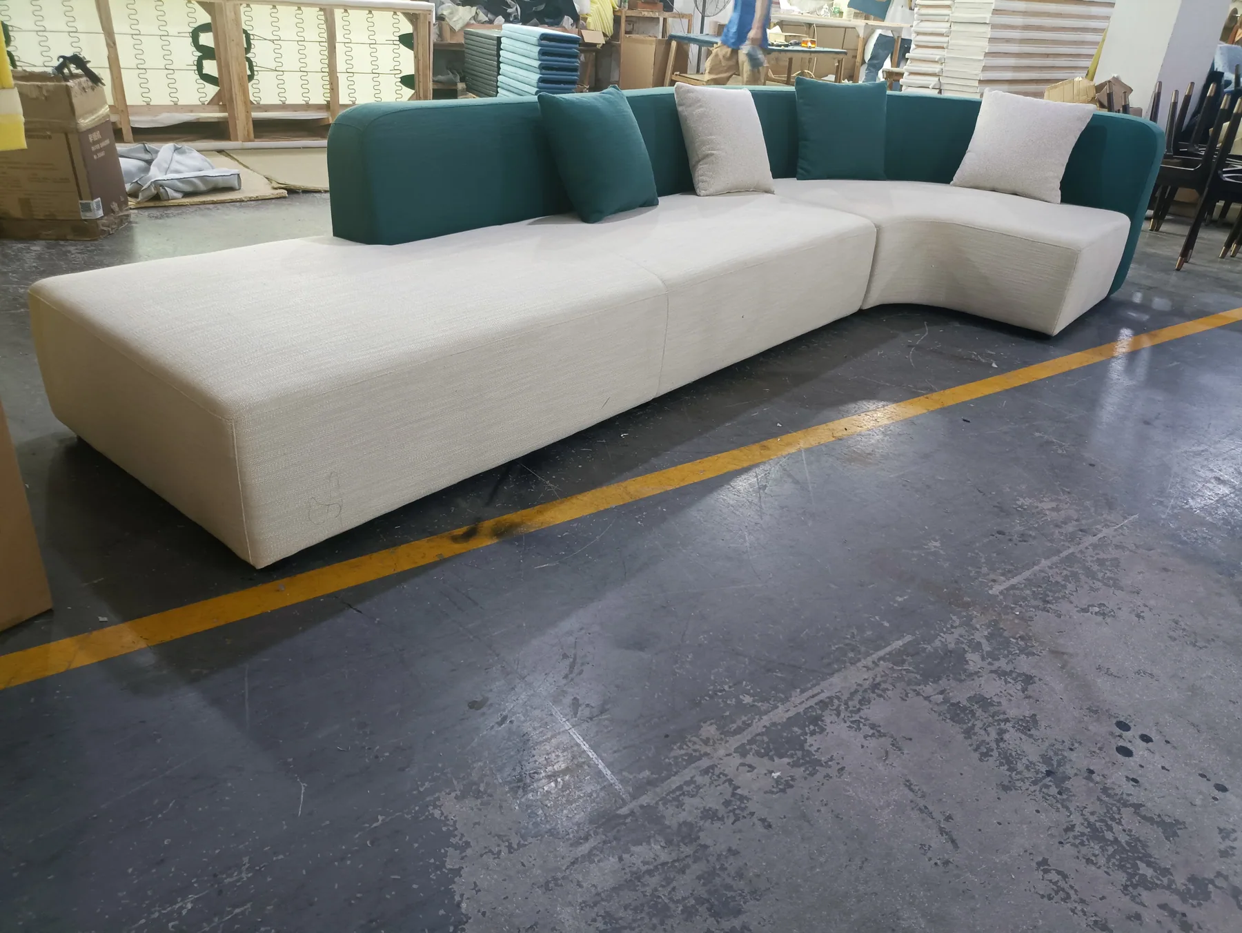 Curved modular sectional with a wide open terminal seat