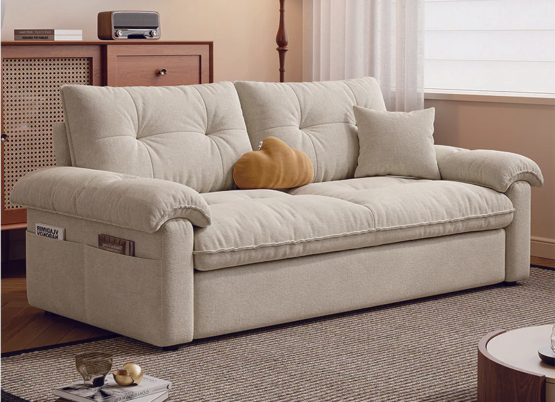 Ivory button-tufted manual pull-out sofa bed with soft rolled arms in sofa mode