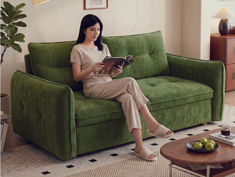 Green box-arm manual pull-out sofa bed with two loose back cushions