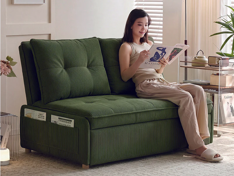 Deep-green armless pull-out sofa bed with split tufted back in sofa mode