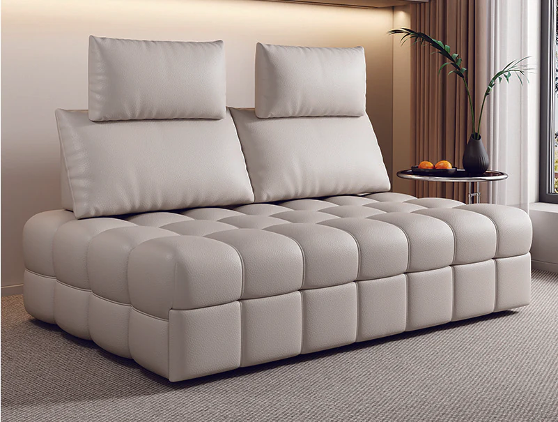 Ivory grid-tufted pull-out sofa bed with raised movable backrests and head cushions