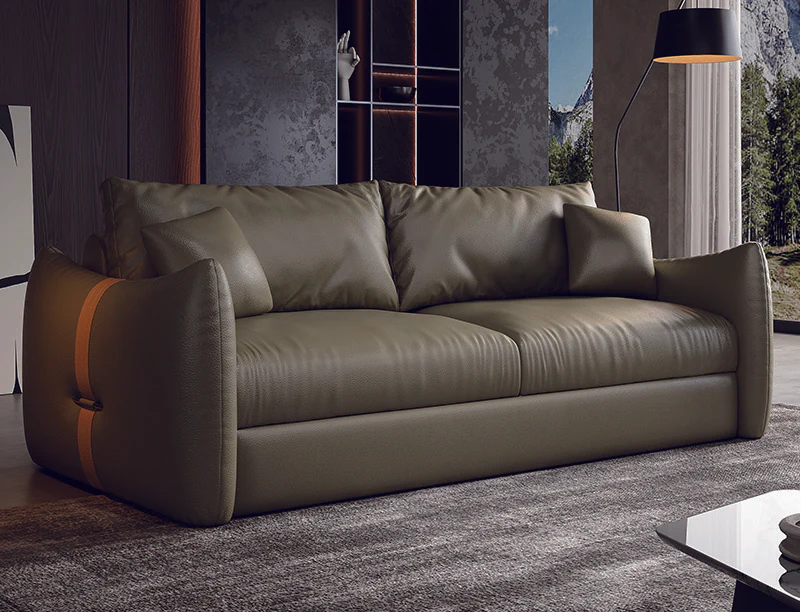 Olive-green fold-out sofa bed with warm contrast straps on rounded arms
