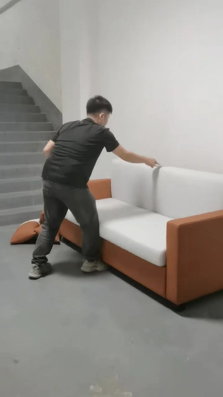White modern sofa bed with contrasting warm-toned side accents
