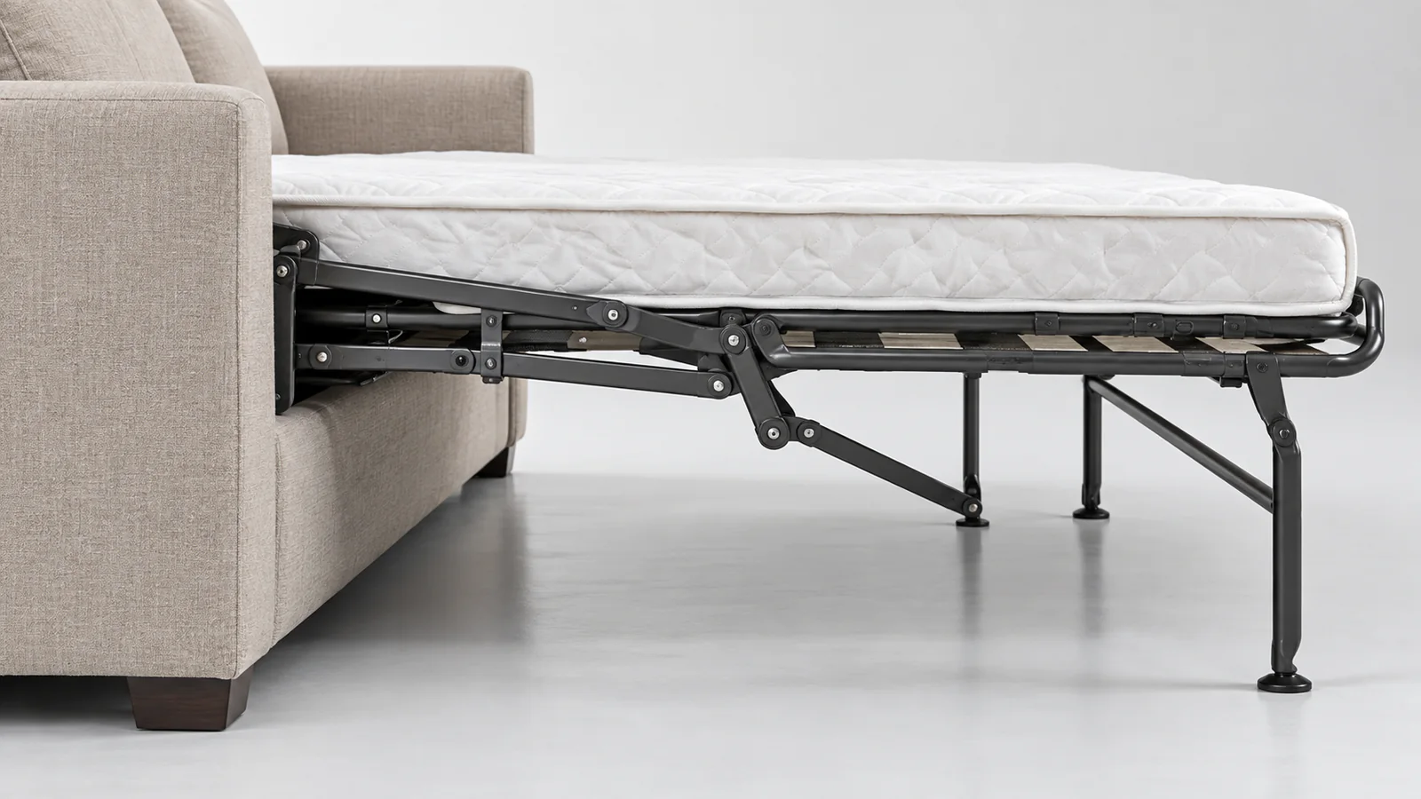 Side detail of folding pull-out sofa bed frame and floor supports