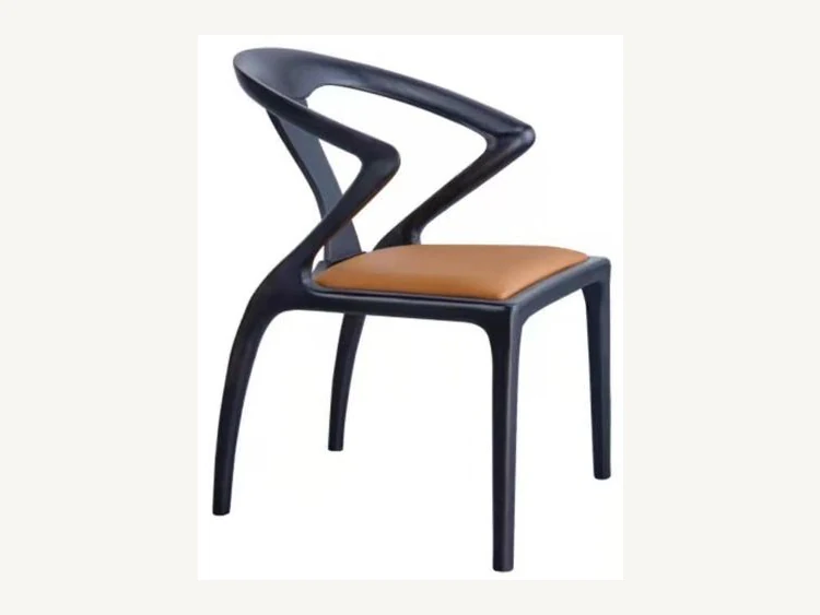 Sculptural open-back dining chair with warm upholstered seat