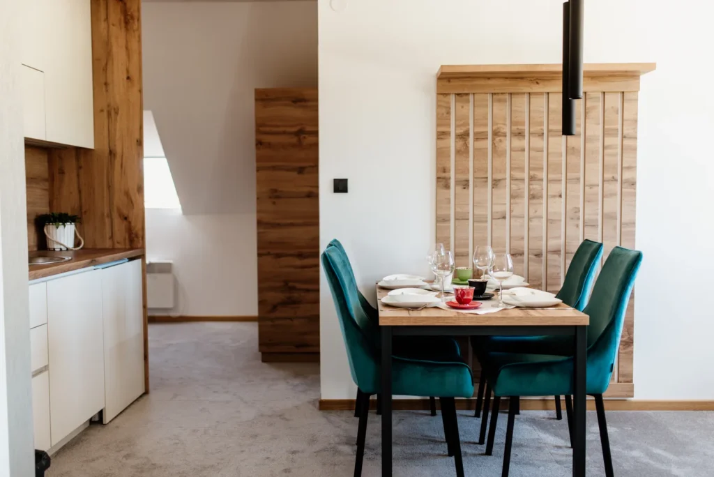 Green upholstered dining chairs grouped at a rectangular table