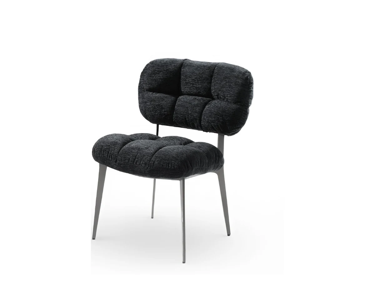 Dining chair with segmented back and seat cushions on a slim steel base