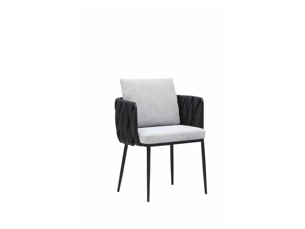 Dining chair with narrow black frame, layered cushions and textured side detail