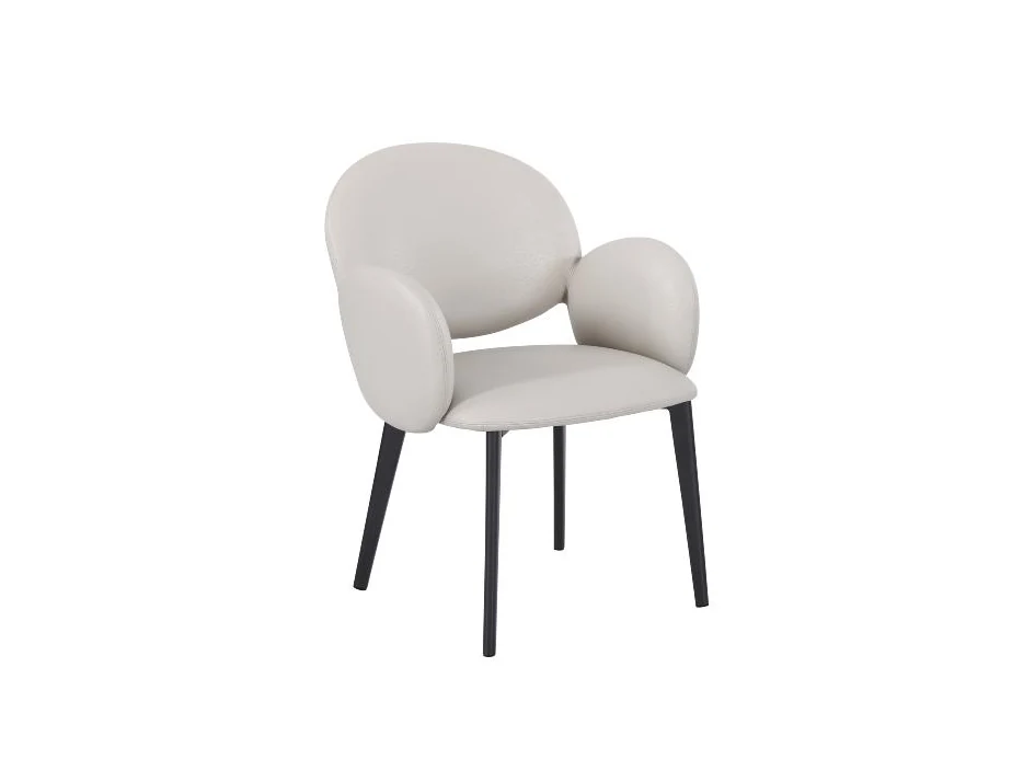 Rounded dining armchair with layered cushions and slender steel legs
