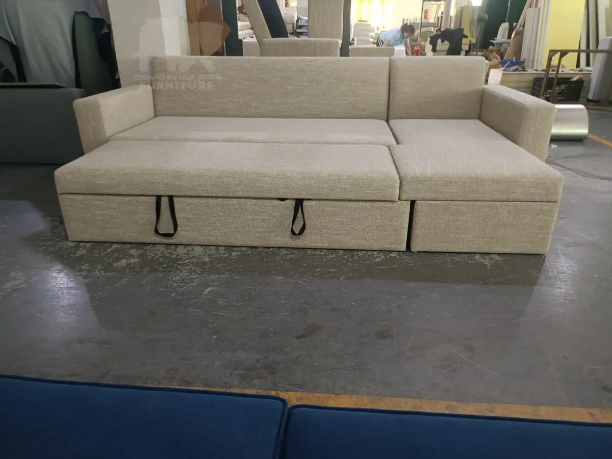 Beige sectional sleeper sofa with its front sleeping section extended